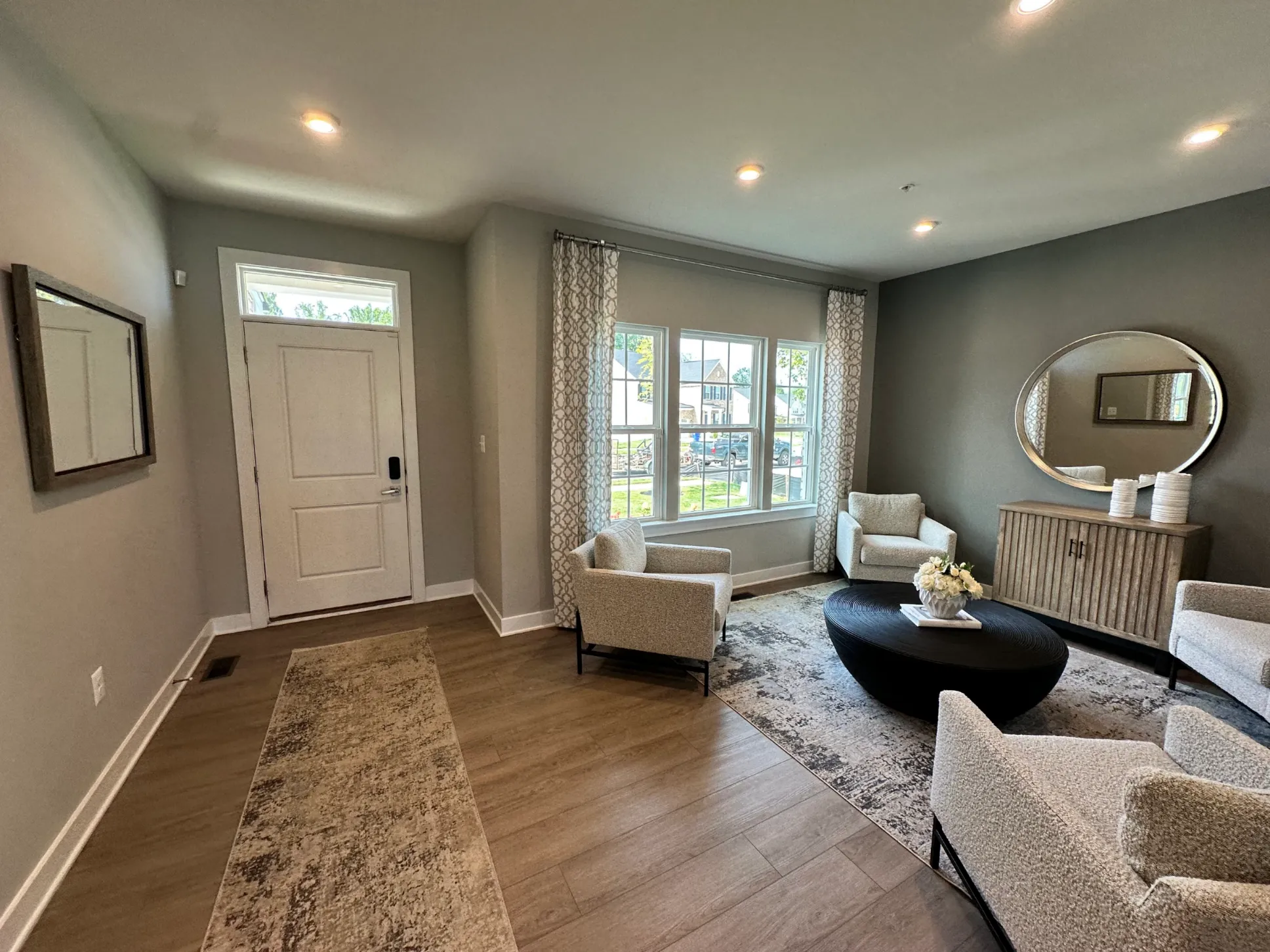 Living room with dark grey walls and white trim located in Washington D.C