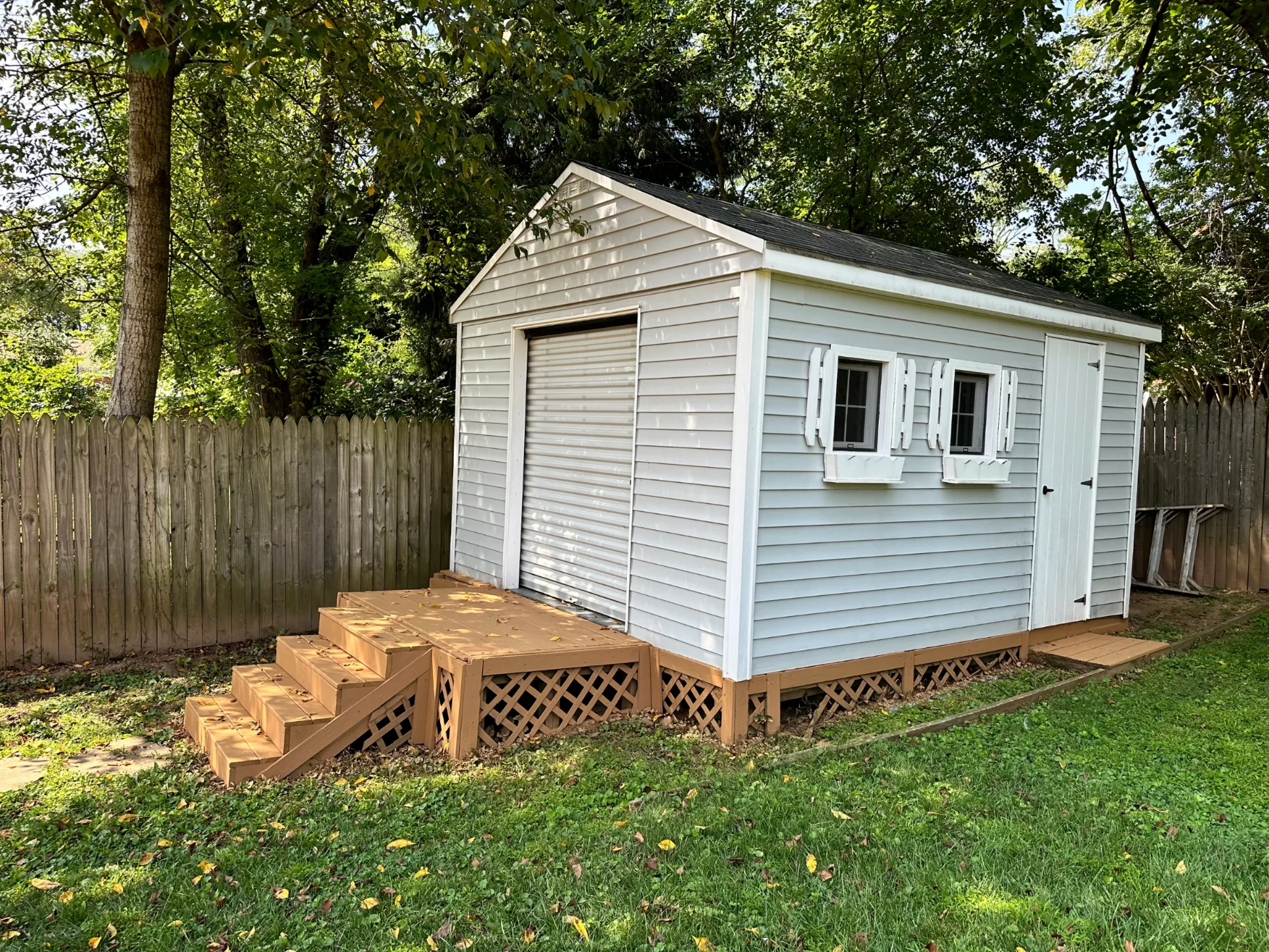 power washed shed siding and wood stairs. Stairs are restained.