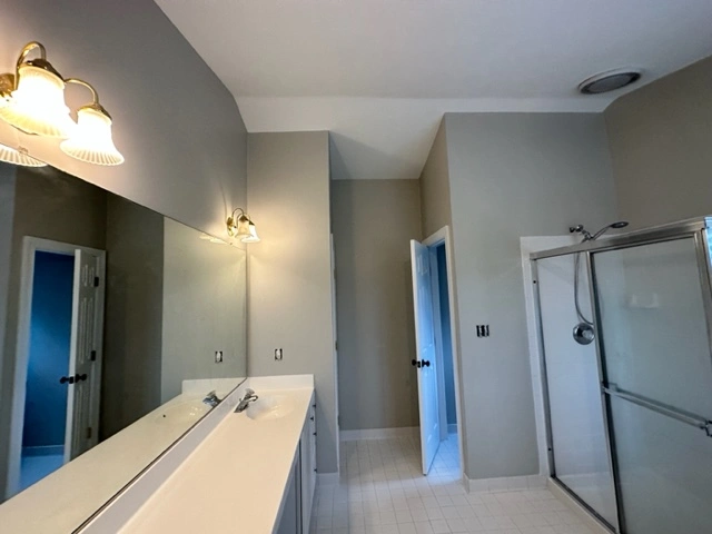 another angle of the rockville home bathroom with beige walls and white trim.